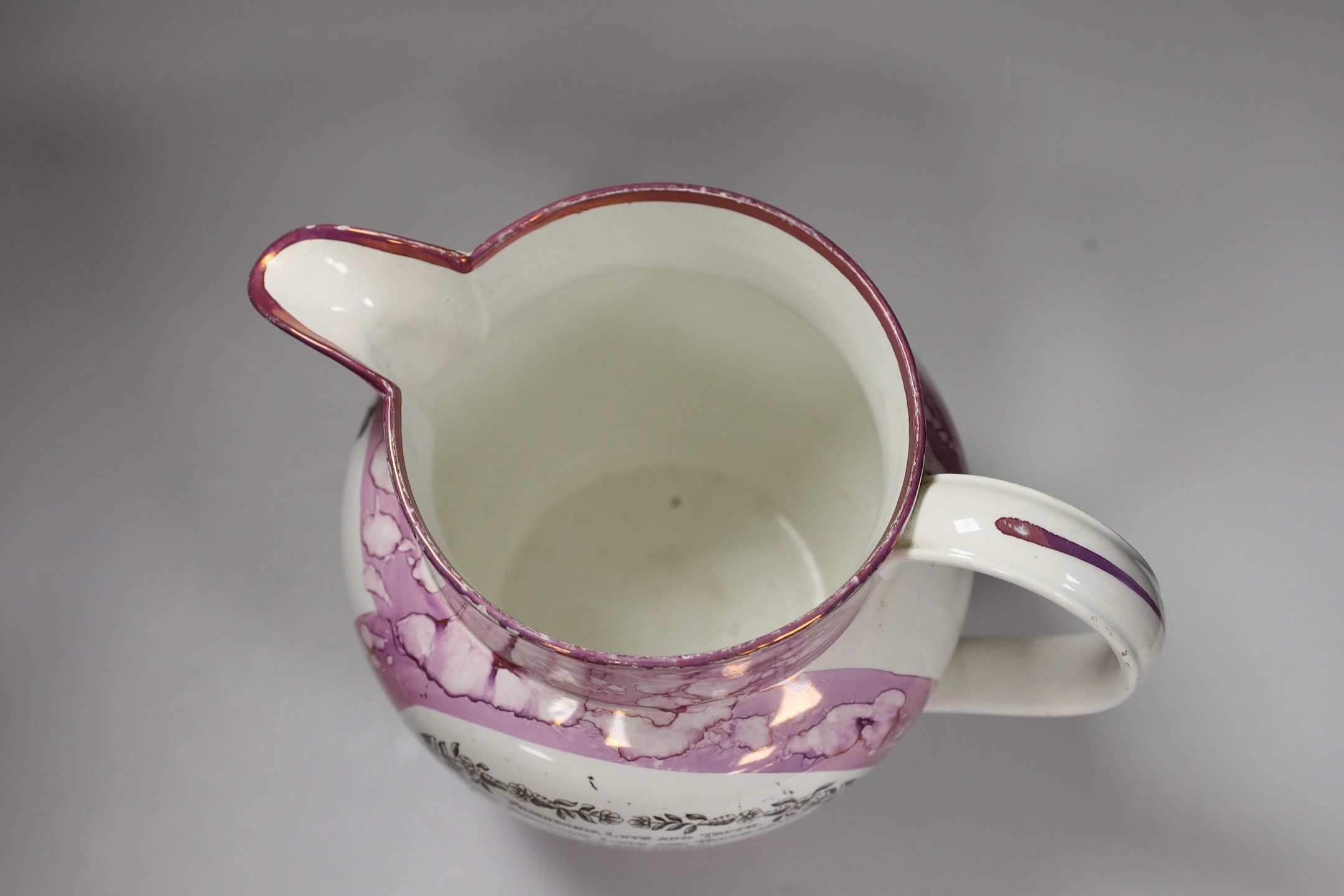 A Sunderland pink lustre ‘Northumberland 74’ and ‘ View of the iron bridge over the Wear’ jug, early 19th century, 23cm